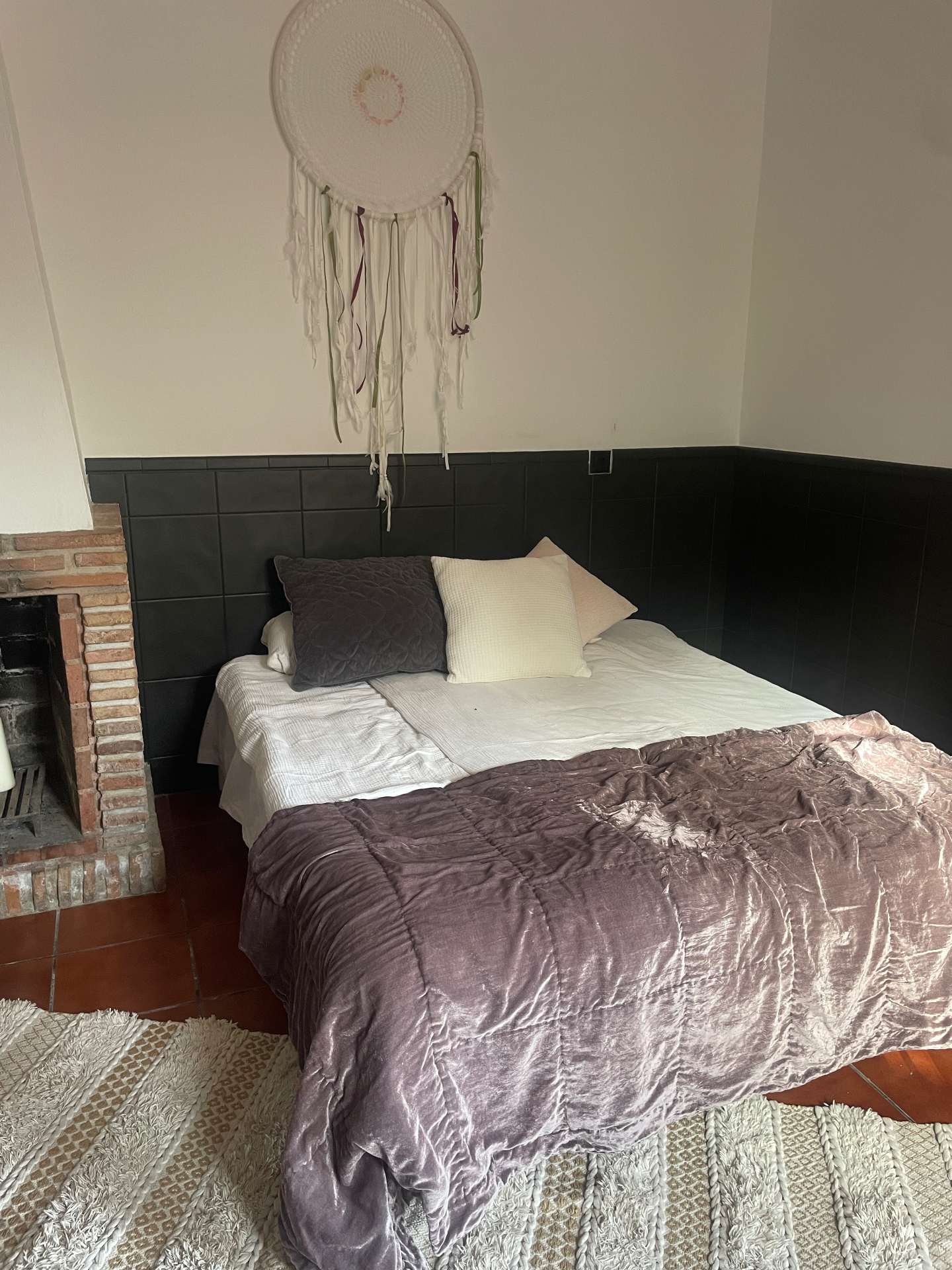 Bedroom with fireplace and dreamcatcher